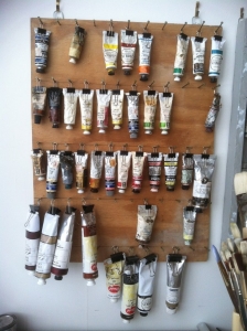 Use Binder clips to hang paint tubes